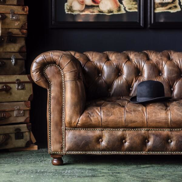 What is a leather sofa with buttons called?