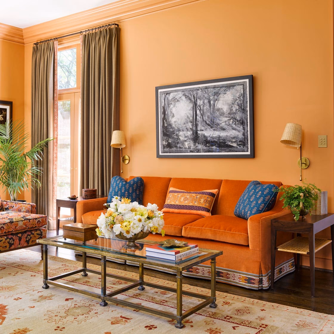 What color goes with an orange sofa?